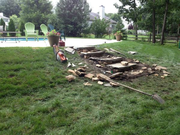 These photos are from the design and build of a boulder retaing wall and steps