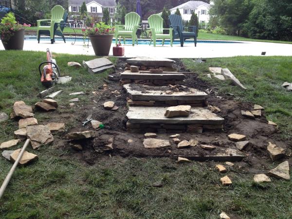 These photos are from the design and build of a boulder retaing wall and steps