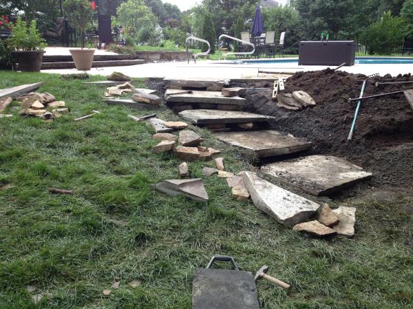 These photos are from the design and build of a boulder retaing wall and steps