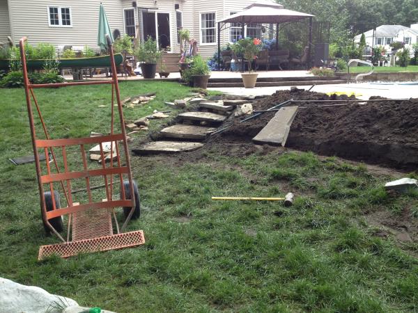 These photos are from the design and build of a boulder retaing wall and steps