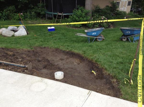 These photos are from the design and build of a boulder retaing wall and steps