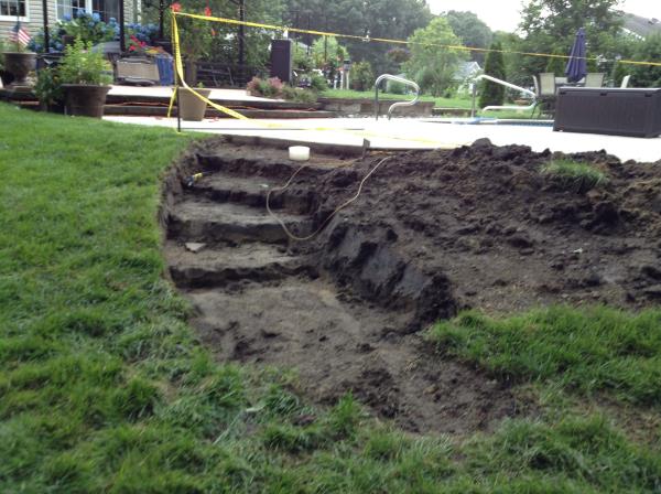 These photos are from the design and build of a boulder retaing wall and steps