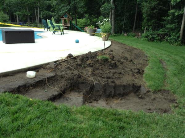 These photos are from the design and build of a boulder retaing wall and steps